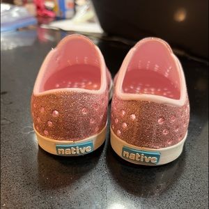 Pink glitter slip ons.
